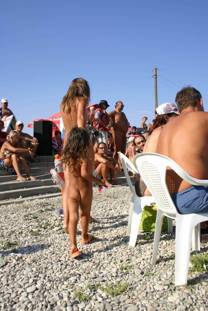 Naturist Standing Sideline - People who participate in nude recreation seek psychological comfort